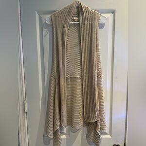 Sleeveless open weave sweater with belt